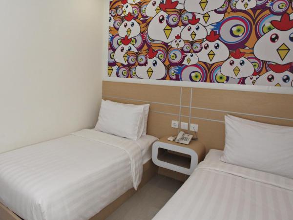 Nite & Day Surabaya - Gunungsari : photo 1 de la chambre chambre deluxe double ou lits jumeaux