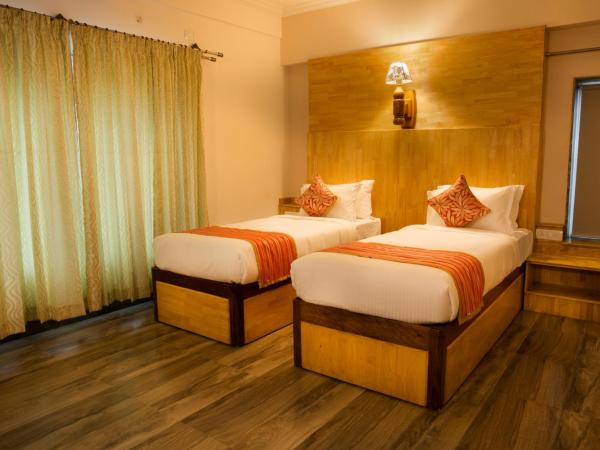 Hotel Presidency-Electronic City Phase II : photo 1 de la chambre chambre deluxe double ou lits jumeaux