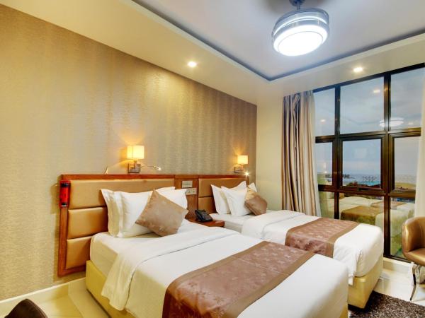 Unima Grand : photo 1 de la chambre chambre deluxe - navette aéroport aller-retour gratuite et réduction de 10 % sur nourriture, boissons et spa - vue sur océan