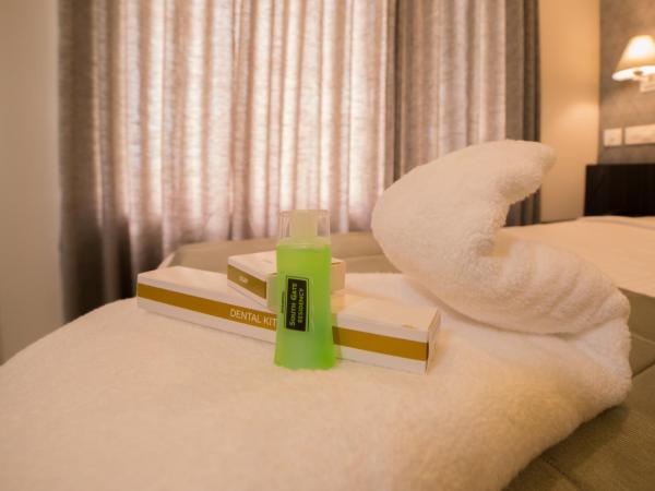 South Gate Residency : photo 1 de la chambre chambre supérieure lit queen-size