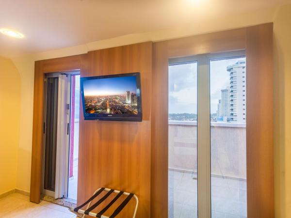 Praiamar Express Hotel : photo 4 de la chambre chambre de luxe - vue sur mer et balcon