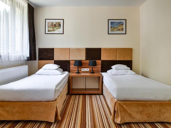 Boutique Hotel's : photo 9 de la chambre chambre lits jumeaux