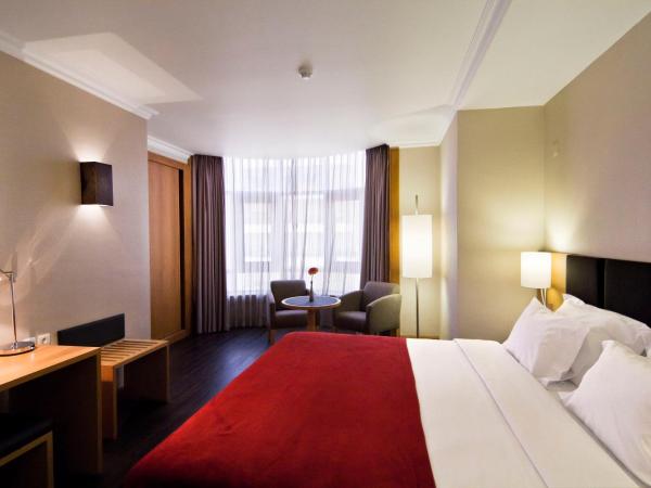 SANA Reno Hotel : photo 1 de la chambre chambre lits jumeaux avec lit d’appoint - 301