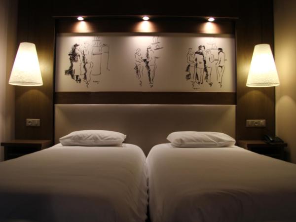 Le Safari Hotel Restaurant : photo 1 de la chambre chambre lits jumeaux - côté cour