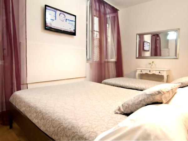 Un Patio en Santa Cruz : photo 4 de la chambre chambre double avec lit d'appoint