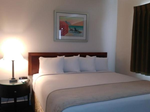 Beach Place Hotel : photo 4 de la chambre hébergement lit king-size supérieur avec kitchenette - parking gratuit