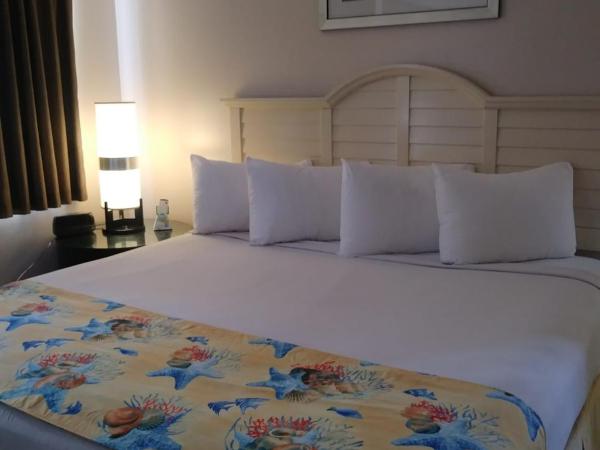 Beach Place Hotel : photo 1 de la chambre hébergement lit king-size supérieur avec kitchenette - parking gratuit