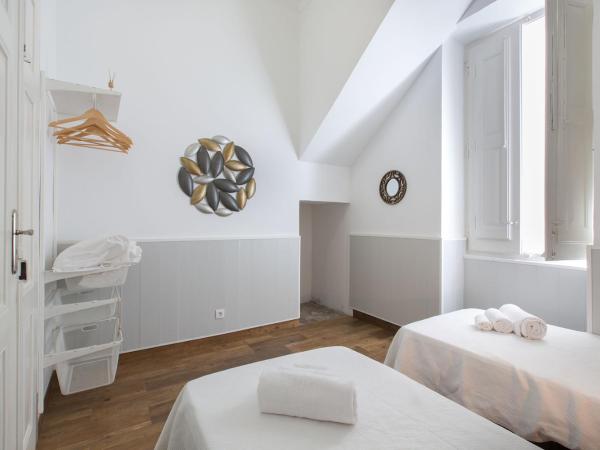 Faro Cosy Guesthouse : photo 4 de la chambre chambre double ou lits jumeaux avec salle de bains commune