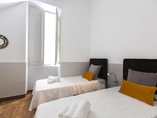 Faro Cosy Guesthouse : photo 3 de la chambre chambre double ou lits jumeaux avec salle de bains commune