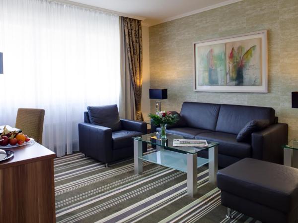 Best Western Plus Hotel Böttcherhof : photo 5 de la chambre appartement avec lit double et cuisine