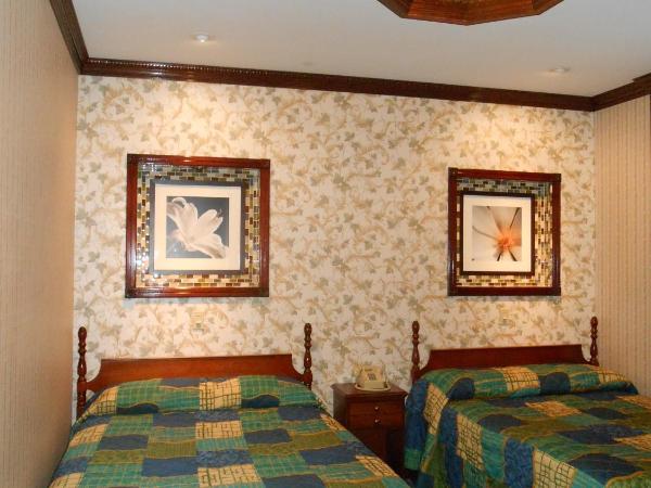 Hotel 31 Extended Stay : photo 4 de la chambre chambre lits jumeaux avec salle de bains commune