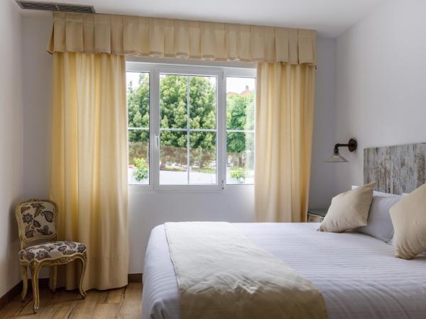 Suite Home Pinares : photo 6 de la chambre chambre double ou lits jumeaux