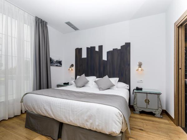 Suite Home Pinares : photo 4 de la chambre chambre double ou lits jumeaux