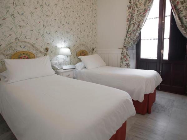 Basic Hotel Puerta de Sevilla : photo 3 de la chambre chambre double ou lits jumeaux standard