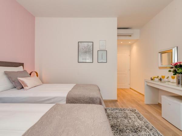 CAPITAL Apartments and Rooms : photo 2 de la chambre chambre double deluxe (1 adulte + 2 enfants)