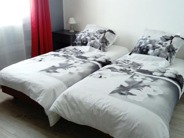 L'Hibiscus Chambre d'Hôte : photo 4 de la chambre chambre lits jumeaux - vue sur ville