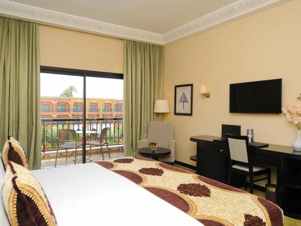 DWO Marrakech Ennakhil : photo 9 de la chambre chambre double ou lits jumeaux supérieure - vue sur jardin