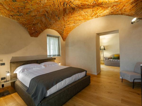 Relais San Vigilio al Castello : photo 2 de la chambre suite familiale deluxe