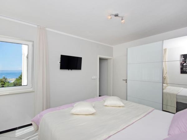 Villa Inis : photo 6 de la chambre suite lit queen-size – vue sur mer