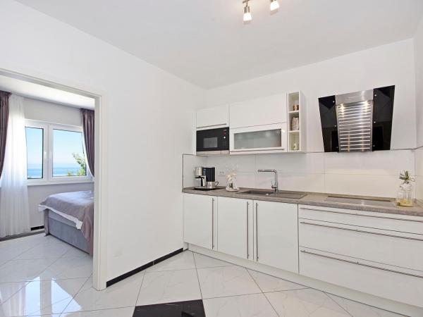 Villa Inis : photo 8 de la chambre suite lit queen-size – vue sur mer