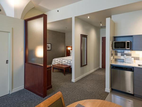 Le Square Phillips Hôtel & Suites : photo 1 de la chambre suite loft avec 1 lit queen-size