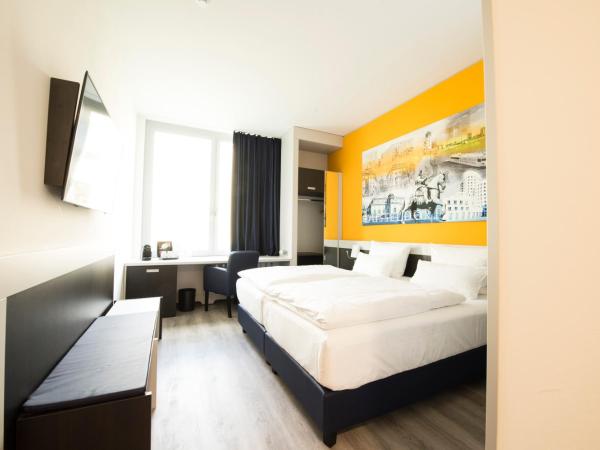 Carathotel Düsseldorf City : photo 1 de la chambre chambre double ou lits jumeaux standard