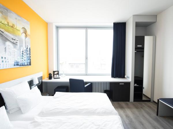 Carathotel Düsseldorf City : photo 7 de la chambre chambre double ou lits jumeaux standard
