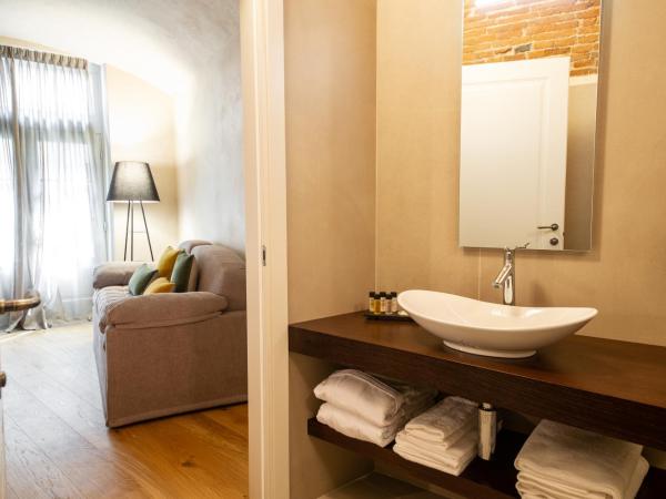 Relais San Vigilio al Castello : photo 1 de la chambre suite familiale deluxe