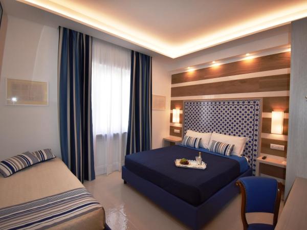 Melody Sorrento Suites : photo 4 de la chambre chambre triple classique