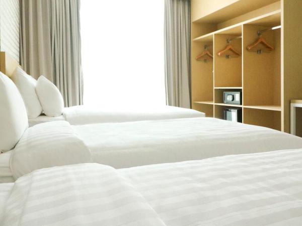 PALM PARK Hotel Surabaya : photo 4 de la chambre chambre triple deluxe