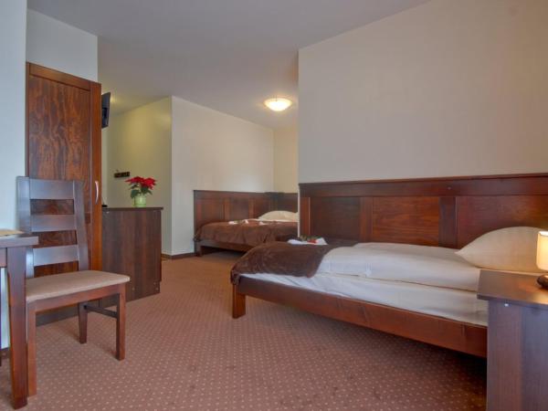 Willa Na Szczycie : photo 2 de la chambre chambre triple avec salle de bains privative
