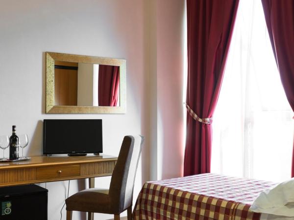 Hotel Il Giardino : photo 6 de la chambre chambre triple