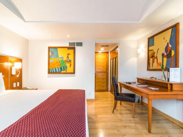 Eurostars Zona Rosa Suites : photo 7 de la chambre suite junior avec lit king-size