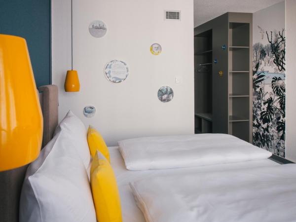 Vienna House Easy by Wyndham Leipzig : photo 7 de la chambre chambre confort accessible aux personnes à mobilité réduite
