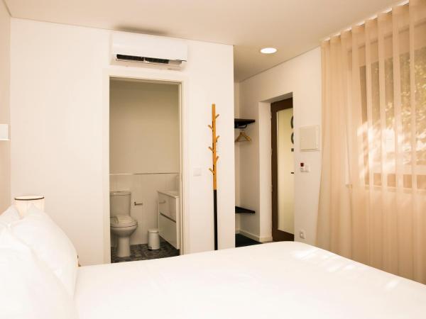 BO - Álvares Cabral GuestHouse : photo 5 de la chambre chambre double - vue sur jardin