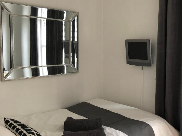 parklane guest house : photo 3 de la chambre chambre simple avec toilettes et douche communes