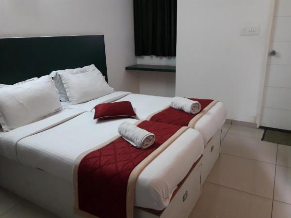 SAP Golden Grande Electronic City : photo 1 de la chambre chambre double standard
