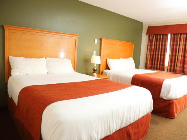 Chateau Motel : photo 1 de la chambre chambre de luxe avec 2 lits queen-size.