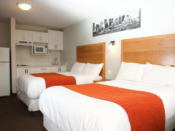 Chateau Motel : photo 1 de la chambre chambre avec 2 lits doubles et kitchenette
