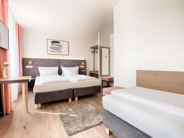 Home Hotel : photo 5 de la chambre chambre triple