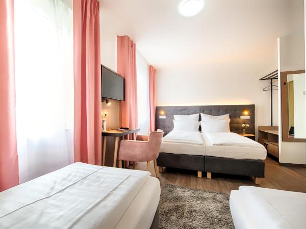 Home Hotel : photo 9 de la chambre chambre quadruple standard