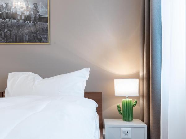 Hotel Birsighof Basel City Center : photo 9 de la chambre chambre double ou lits jumeaux - vue sur jardin