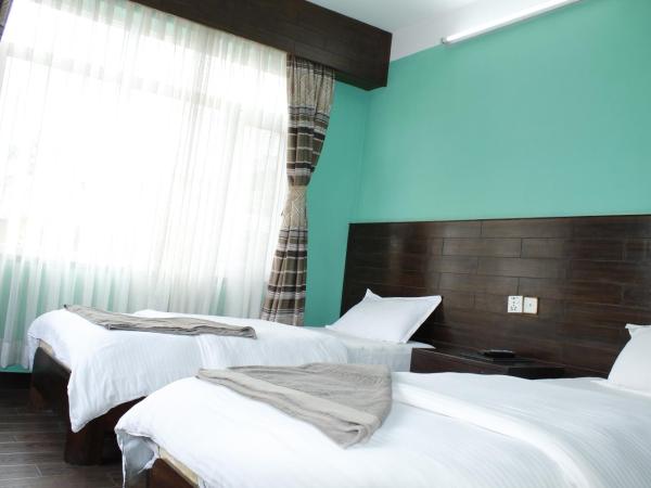 Mount Annapurna Guest House : photo 2 de la chambre chambre lits jumeaux