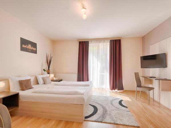 Triple M Hotel : photo 5 de la chambre chambre double deluxe avec lit d'appoint