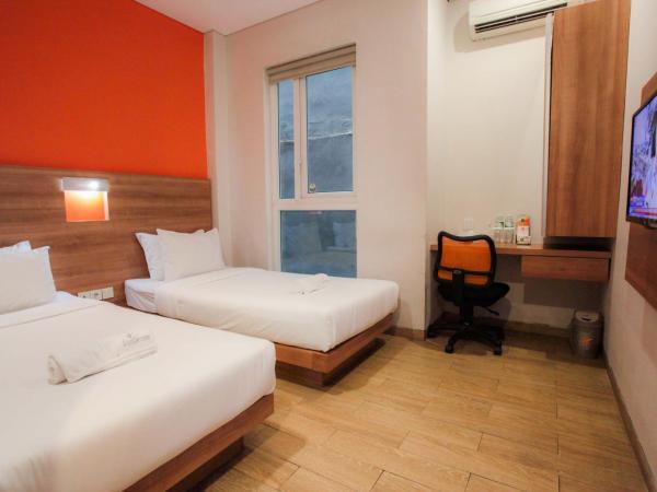 LeGreen Suite Kuningan : photo 3 de la chambre chambre lits jumeaux Économique