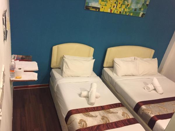 Woodpecker Lodge, Kuching : photo 1 de la chambre chambre triple standard