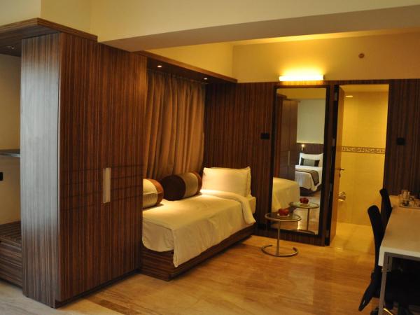 Residency Sarovar Portico : photo 5 de la chambre chambre deluxe double ou lits jumeaux