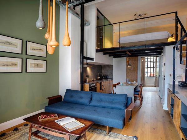 The Foundry Suites : photo 3 de la chambre suite lit king-size avec balcon