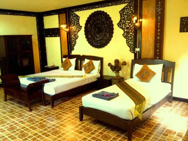 Paradise Pearl Bungalows : photo 3 de la chambre chambre triple - vue sur jardin