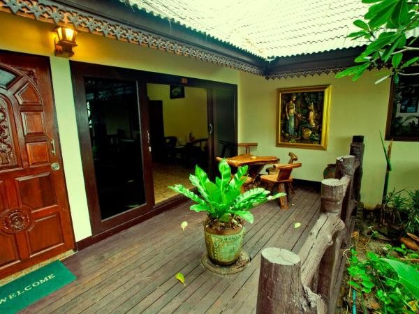 Paradise Pearl Bungalows : photo 4 de la chambre chambre triple - vue sur jardin